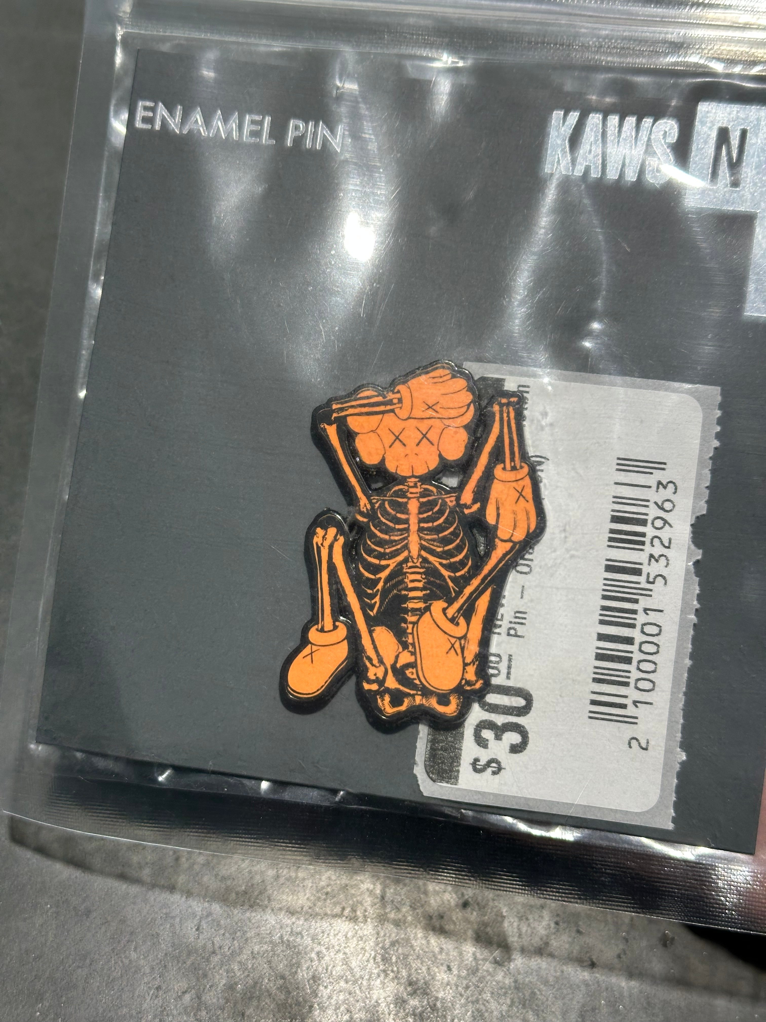 NEW KAWS x NGV SKeleton Pin - Orange (CON)